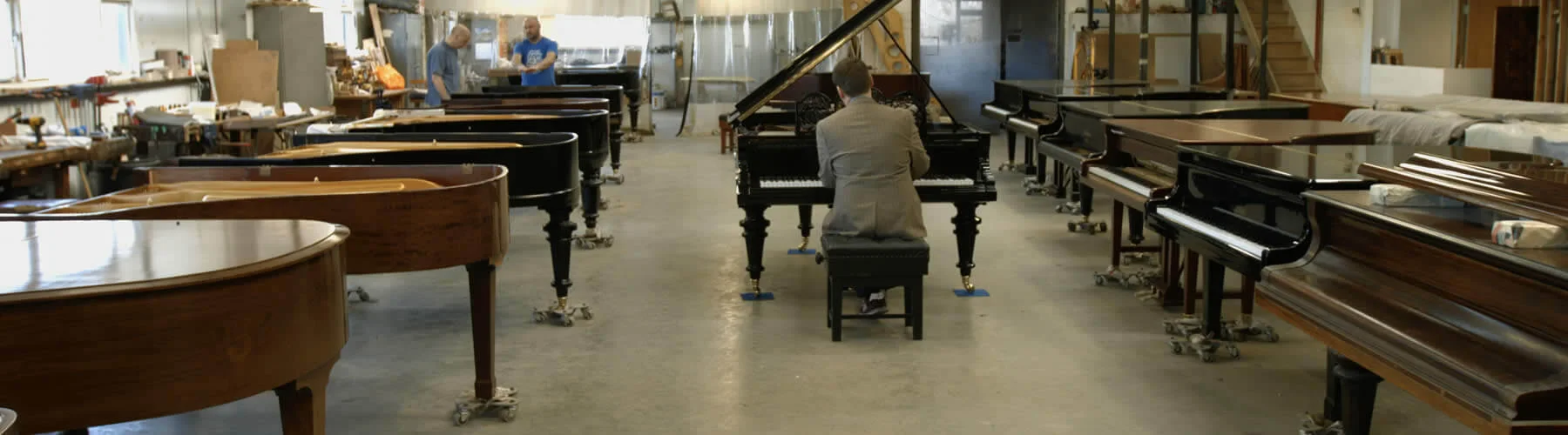 Grand pianos across the Leverett workshop