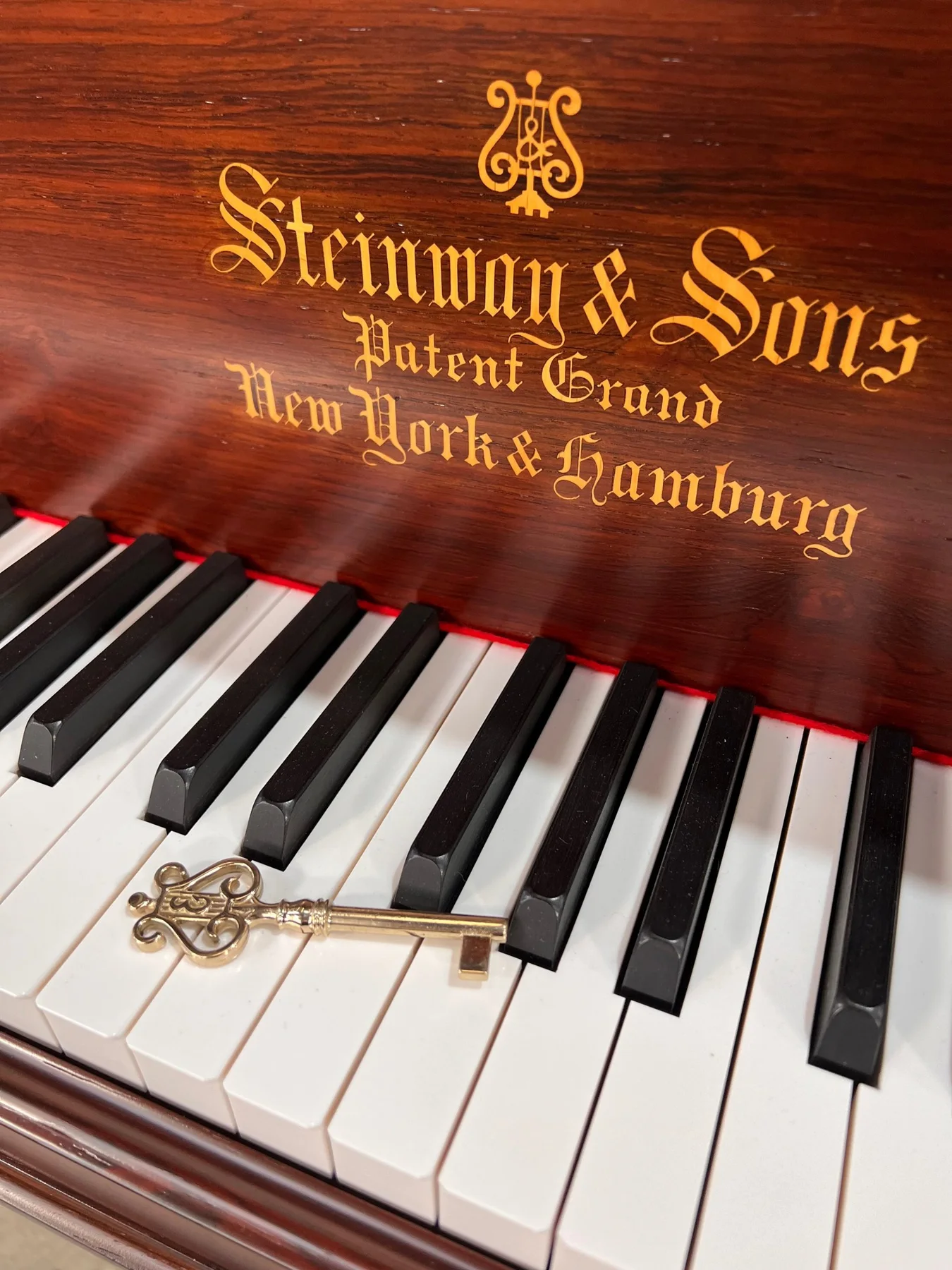 Steinway & Sons nameplate and piano keys