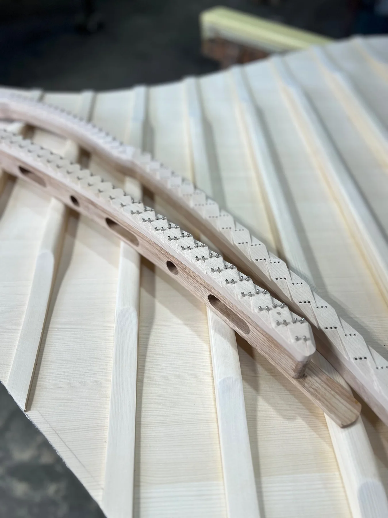 A piano soundboard with individually fitted supporting ribs